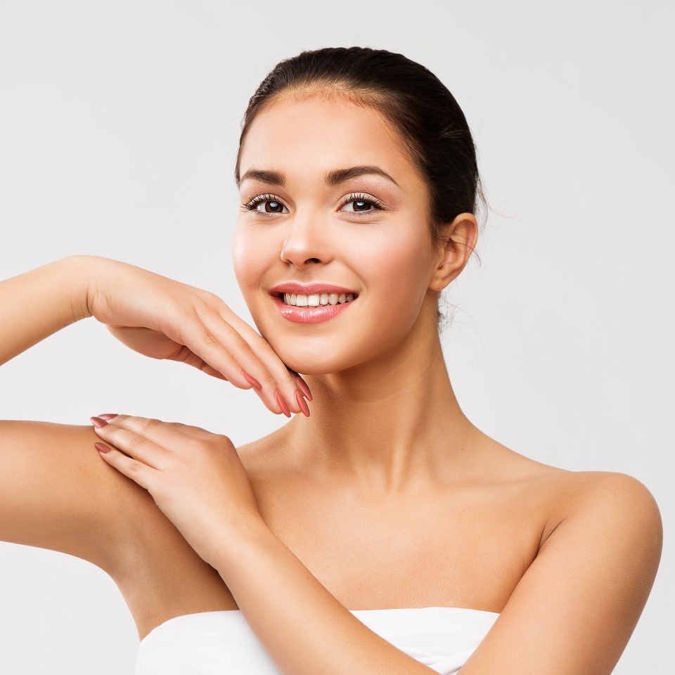 Woman Body and Face Skin Care Cosmetics. Women Shoulder Hand Massage. Beauty Model with Armpit Smooth Clean over White. Hair removal and Epilation