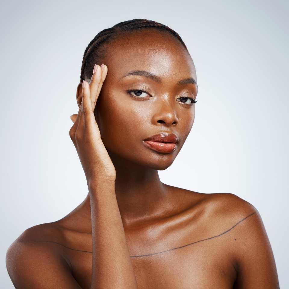 Portrait of black woman, natural beauty or healthy skin for wellness in studio with cosmetics or glow. Dermatology, detox or confident African girl model with skincare results on white background