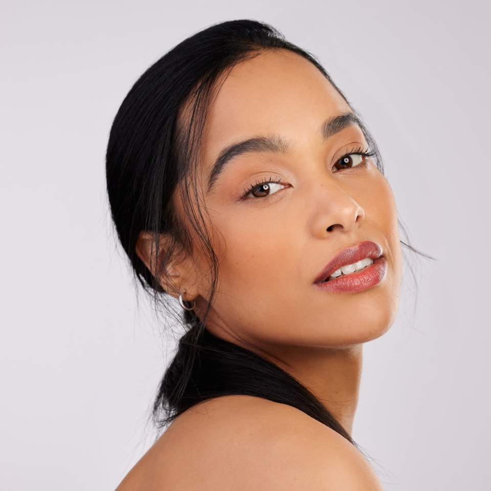 Studio, relax and woman in portrait with makeup, facial aesthetic and confidence by mockup space. Female model, beauty and cosmetics treatment, results and benefits with pride by white background