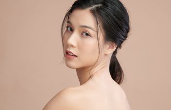 Beautiful young asian woman with clean fresh skin on beige background, Face care, Facial treatment, Cosmetology, beauty and spa, Asian women portrait.